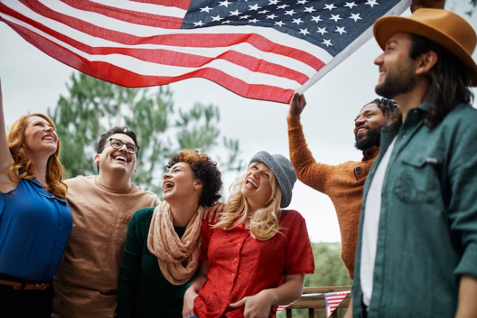 Alunos comemorando com a bandeira dos estados unidos.